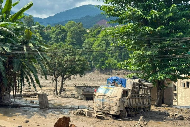 Damaged houses and vehicles are seen in the aftermath of flash floods along the Trishuli River in Nepal’s Nuwakot district