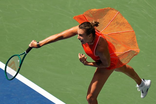 Aryna Sabalenka, of Belarus, follows through on a shot to Camila Osorio,