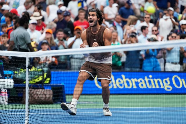 Carlos Alcaraz, of Spain, celebrates winning