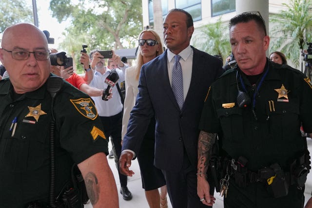 Tiger Woods arrives for the hearing