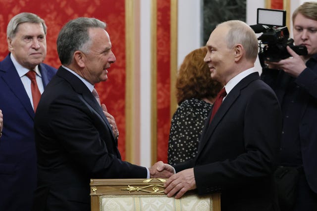 Russian President Vladimir Putin, right, greets US President Donald Trump’s envoy Steve Witkoff, prior to talks at the Senate Palace of the Kremlin in Moscow, on September 5