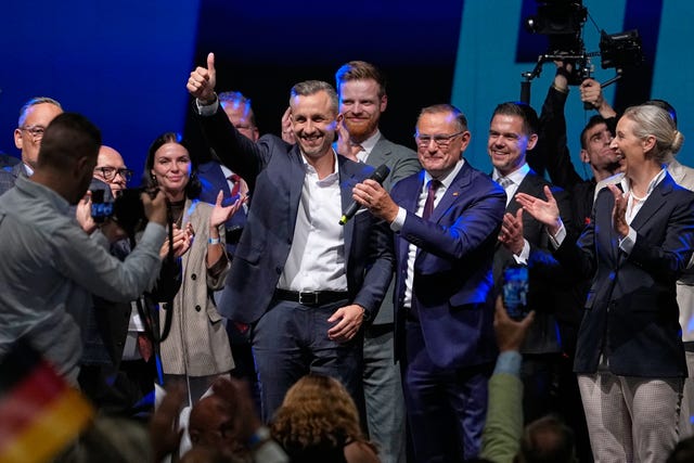 Ulrich Siegmund beside party leaders Tino Chrupalla and Alice Weidel, from left, at an election party of the Alternative for Germany (AfD)