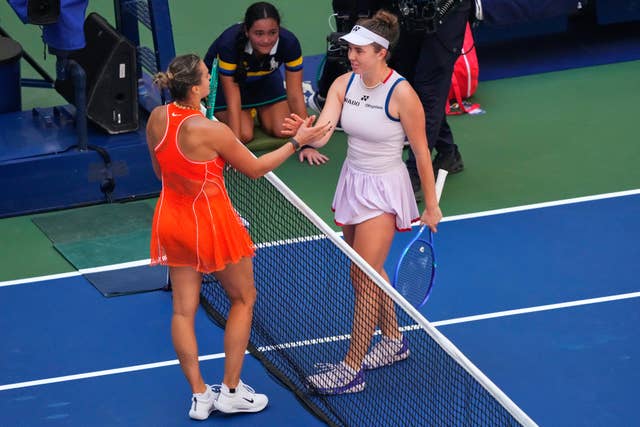 Aryna Sabalenka, left, and Linda Noskova embrace