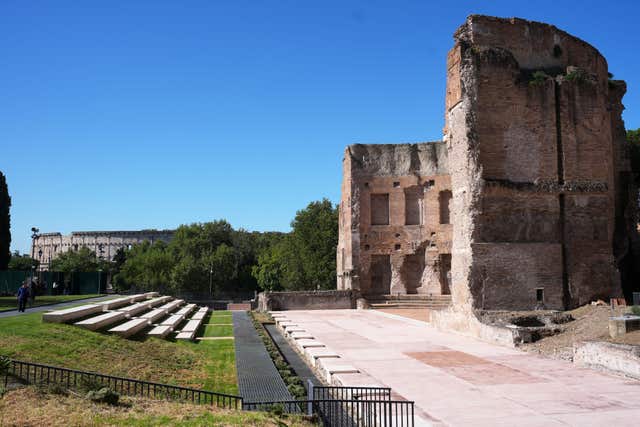 The south-western exedra of the Baths of Trajan, backdropped by the Colosseum, sits above the underground foundations where the restored Painted City fresco and Great Mosaic were discovered