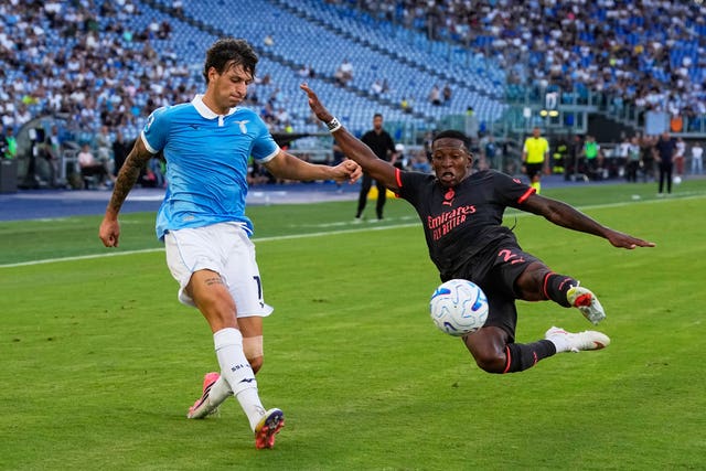 Lazio’s Romano Floriani Mussolini, left, and AC Milan’s Pervis Estupinan fight for the ball