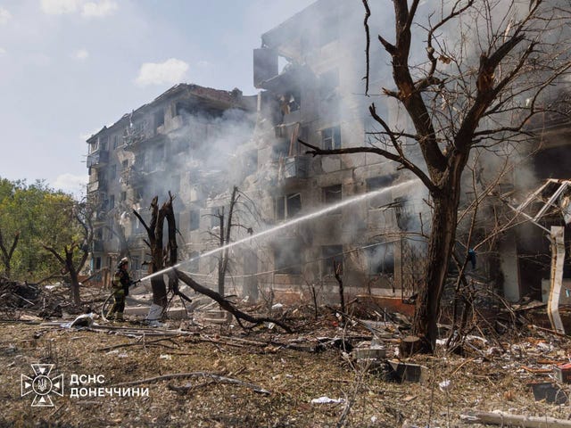 Firefighters put out a fire following a Russian air attack in Kramatorsk, Ukraine,