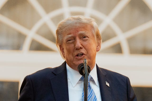 President Donald Trump speaks during a dinner in the Rose Garden of the White House in Washington