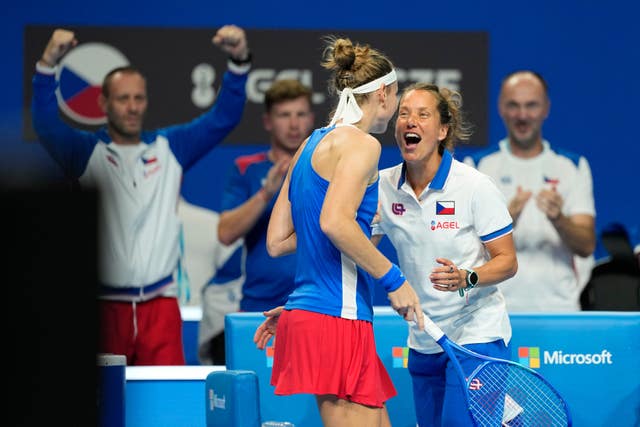 Marie Bouzkova celebrates her victory with captain Barbora Strycova