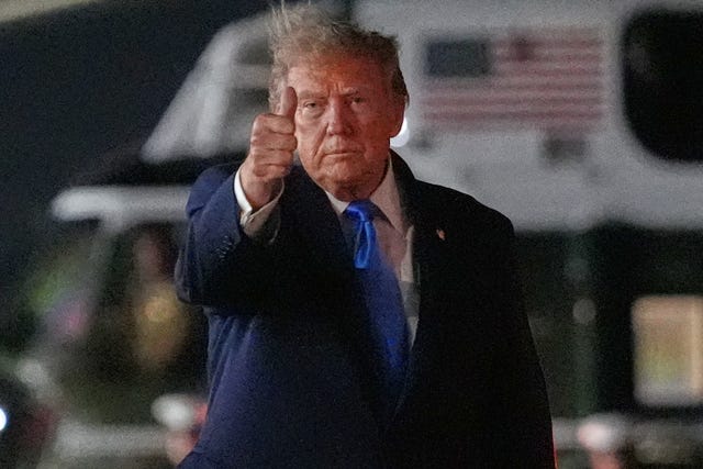 President Donald Trump walks from Marine One to board Air Force One