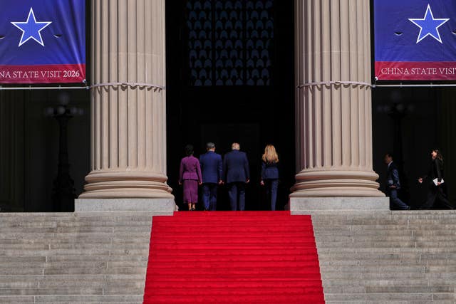 US President Donald Trump, centre right, first lady Melania Trump, right, China’s President Xi Jinping, centre left, and his wife Peng Liyuan walking away at the National Archives Museum in Washington