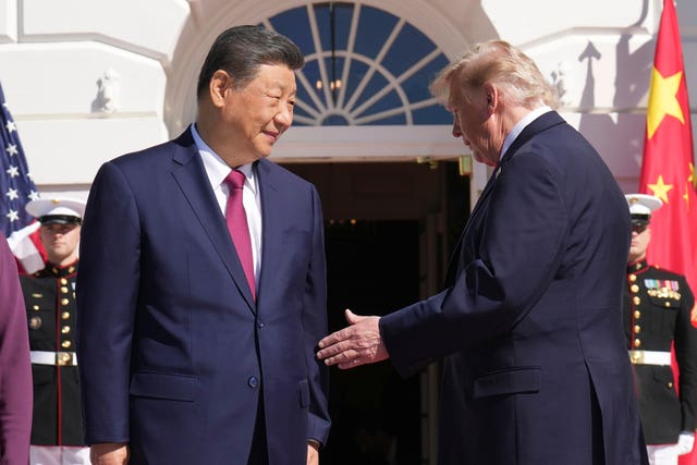 US President Donald Trump, right, greets China’s President Xi Jinping at the White House