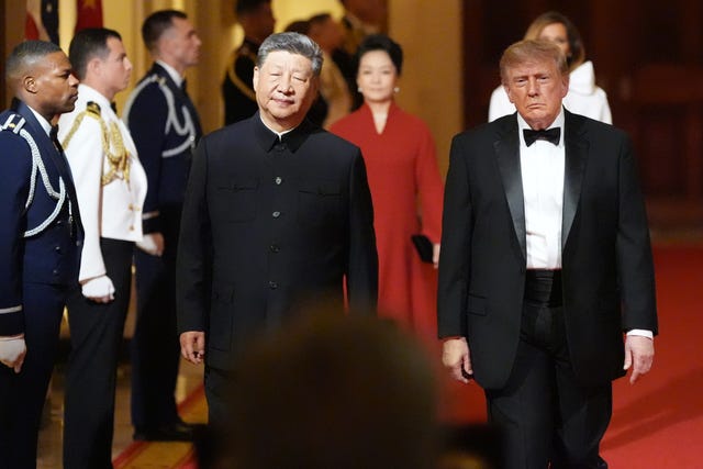 US President Donald Trump arrives with China’s President Xi Jinping for a state dinner at the White House