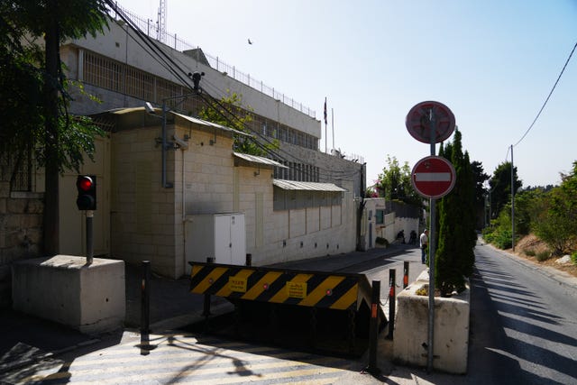 Barricades blocking the main road leading to the consulate