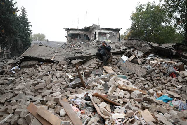 A man sitting in rubble