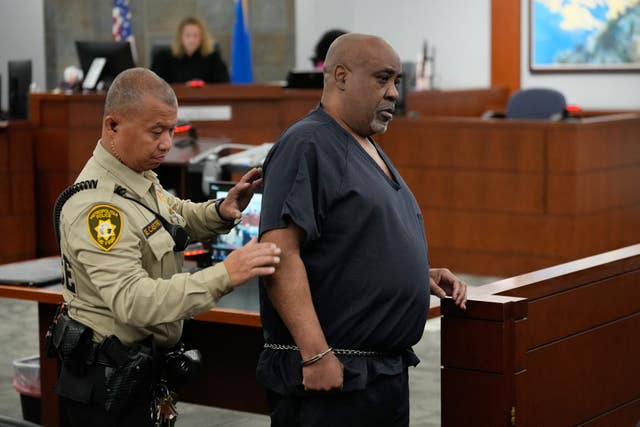 Duane Davis is led from court