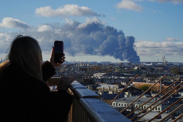 Smoke billows into the sky following Ukrainian drone strikes on an industrial zone in St Petersburg, Russia