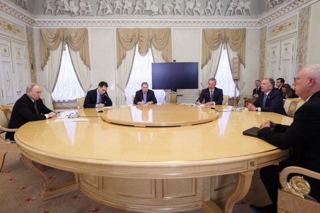 Vladimir Putin and Steve Witkoff around a table during talks in Russia