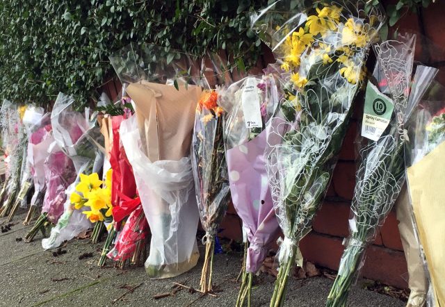 Flowers at the scene of a fatal house fire in Withington, Manchester (Pat Hurst/PA)