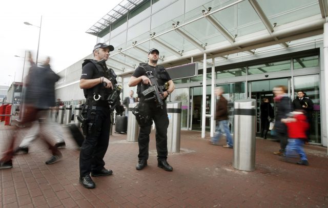 Armed policeman at Edinburgh Airport (Danny Lawson/PA)