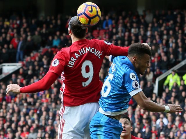 Tyrone Mings feels the full force of Zlatan Ibrahimovic's elbow during the 1-1 draw at Old Trafford