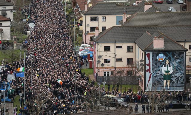 The coffin of Martin McGuinness is carried down Westland Street ahead of his funeral.