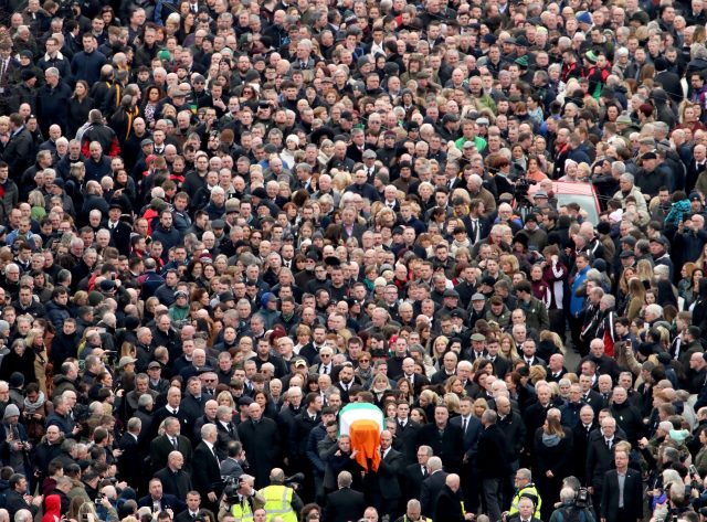 The coffin of Martin McGuinness is carried down Westland Street