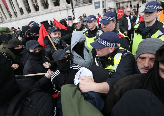Unite Against Fascism demonstrators tussle with police (Jonathan Brady/PA)