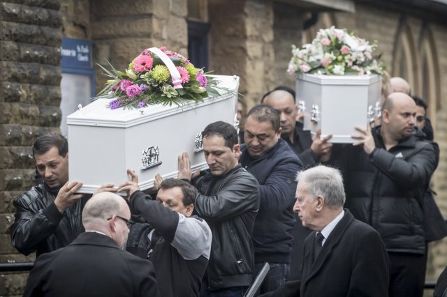 The coffins of hit and run victims Helina Kotlarova, 12 and Zaneta Krokova, 11, leave St Paul's Church in Oldham following their funeral (Danny Lawson/PA)