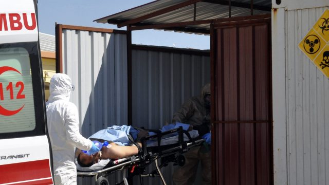 A victim is treated by Turkish medics on the border  (DHA-Depo photos via AP)