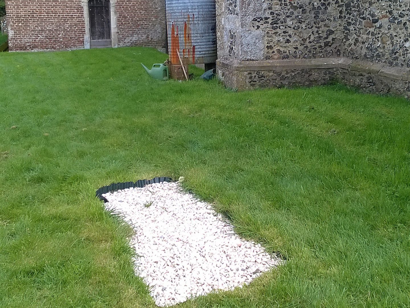 Mystery unmarked grave appears in churchyard.