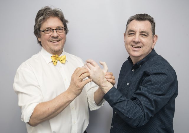 UK's first double hand transplant patient Chris King with consultant plastic surgeon Professor Simon Kay 