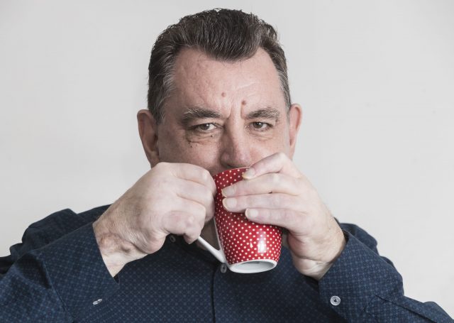  UK's first double hand transplant patient Chris King demonstrates that he can hold a cup of tea