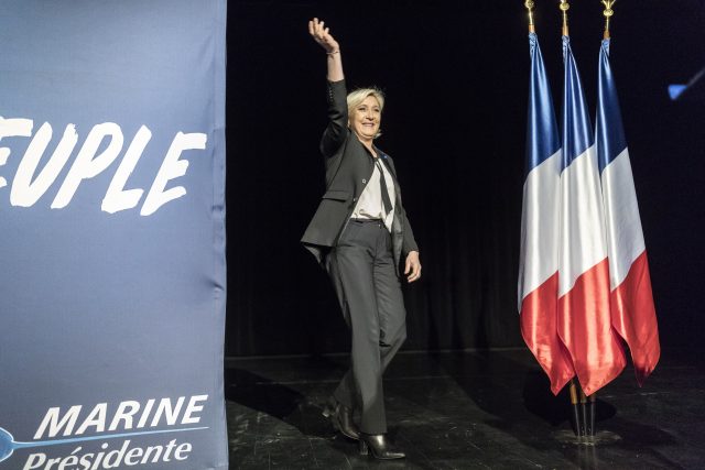 Far-right candidate for the presidential election Marine Le Pen waves during a campaign meeting in Monswiller near Strasbourg (Jean-Francois Badias/AP)