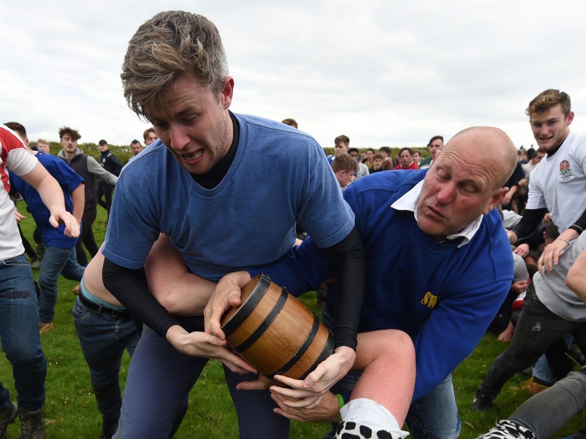 Pie scramble starts bottlekicking tradition which dates back to Roman