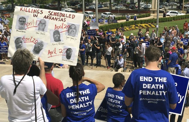 Protesters gather outside the state Capitol building in Little Rock (Kelly P Kissel/AP)