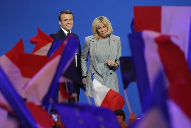 Macron and his wife Brigitte (Christophe Ena/AP)