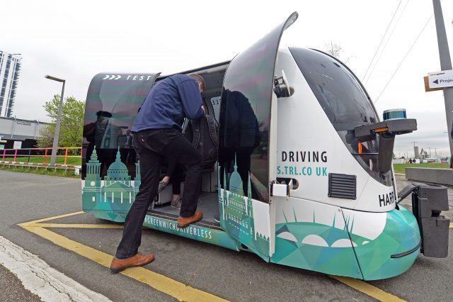 A passenger boarding a driverless service in Greenwich