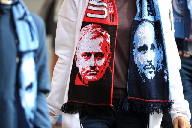 A scarf bearing the faces of Manchester United manager Jose Mourinho and Manchester City manager Pep Guardiola (Mike Egerton/Empics)