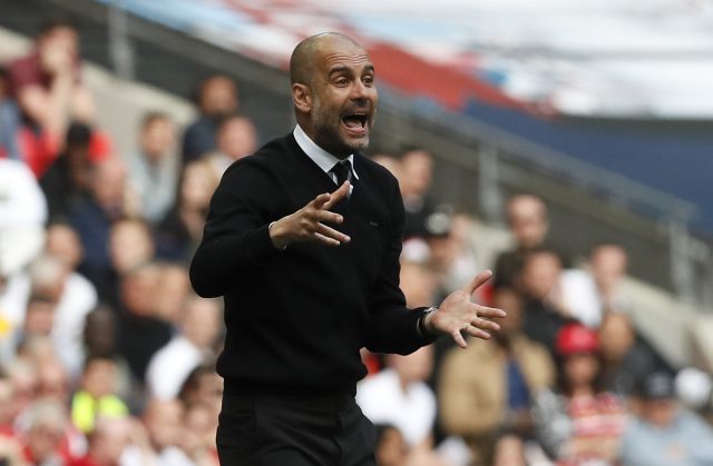 Pep Guardiola prefers fluid football (Kirsty Wigglesworth/AP)