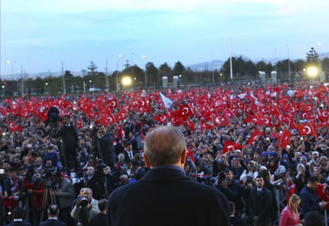 Mr Erdogan speaks at a rally in Ankara (AP)