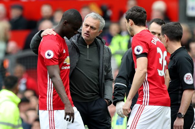 Jose Mourinho puts an arm around Eric Bailly as he leaves the field at Old Trafford