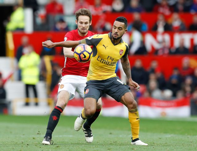 Manchester United's Daley Blind (left) and Arsenal's Theo Walcott