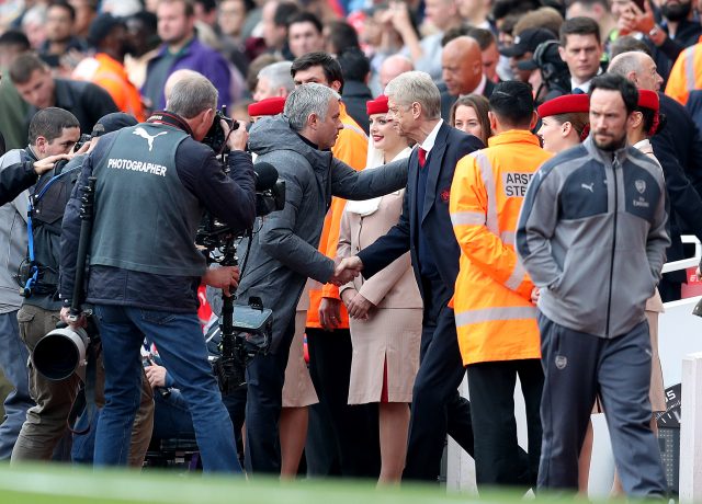 Jose Mourinho, left, shakes hands with Arsene Wenger