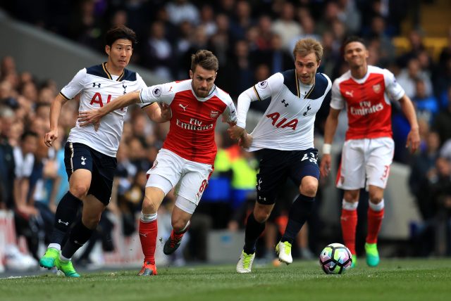 Christian Eriksen gets away from Aaron Ramsey