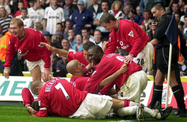 Manchester United's Juan Sebastion Veron is mobbed by team mates after scoring the fourth goal against Tottenham (Kirsty Wigglesworth/PA)