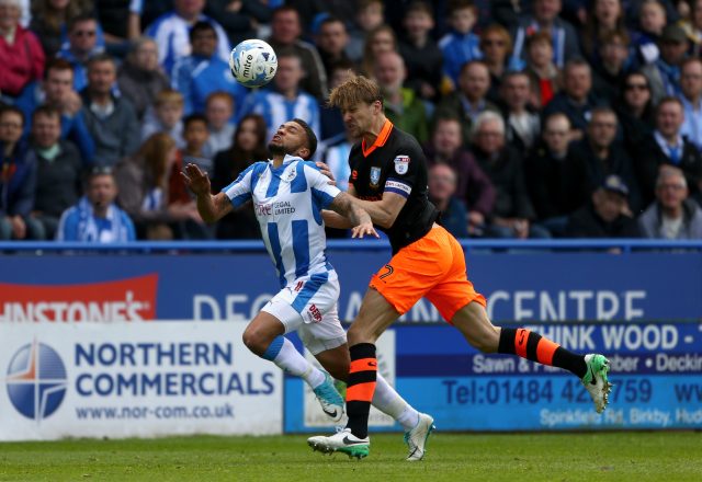 Nahki Wells (left) and Glenn Loovens battle for the ball (Dave Thompson/PA)