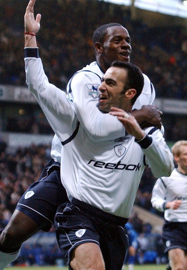Youri Djorkaeff and Delroy Facey celebrate