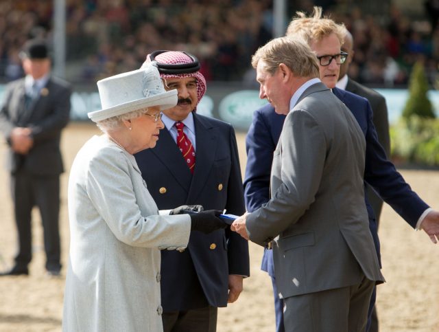 Queen Elizabeth II smiles as she presents an award to Show Jumper Nick Skelton at the Royal Windsor Horse Show (Steve Parsons/PA)