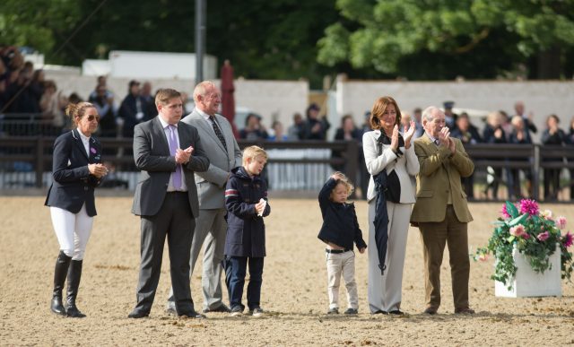 Nick Skelton's family watch as he walks his horse Big Star around the arena (Steve Parsons/PA)