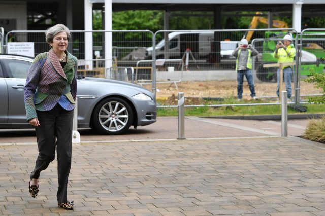 Theresa May confronted by angry voter on visit to Oxford Theresa May confronted by angry voter on visit to Oxford